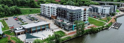 large apartment building beside lake